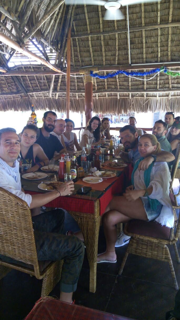 Safari group dining at Vamos Hotel Mikumi thatch restaurant